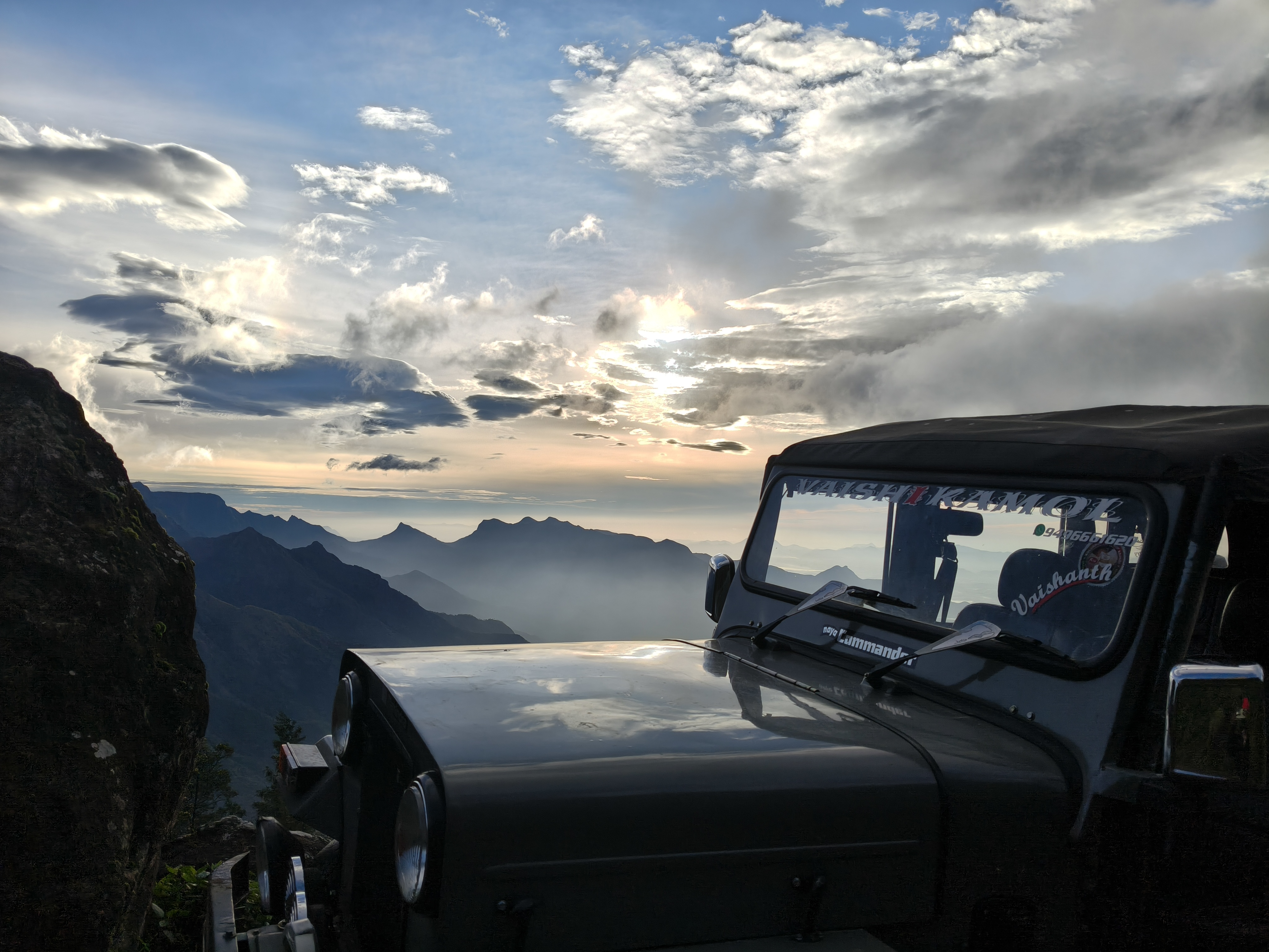 Aerial drone monitoring view above Kolukkumalai clouds and tea plantation valley